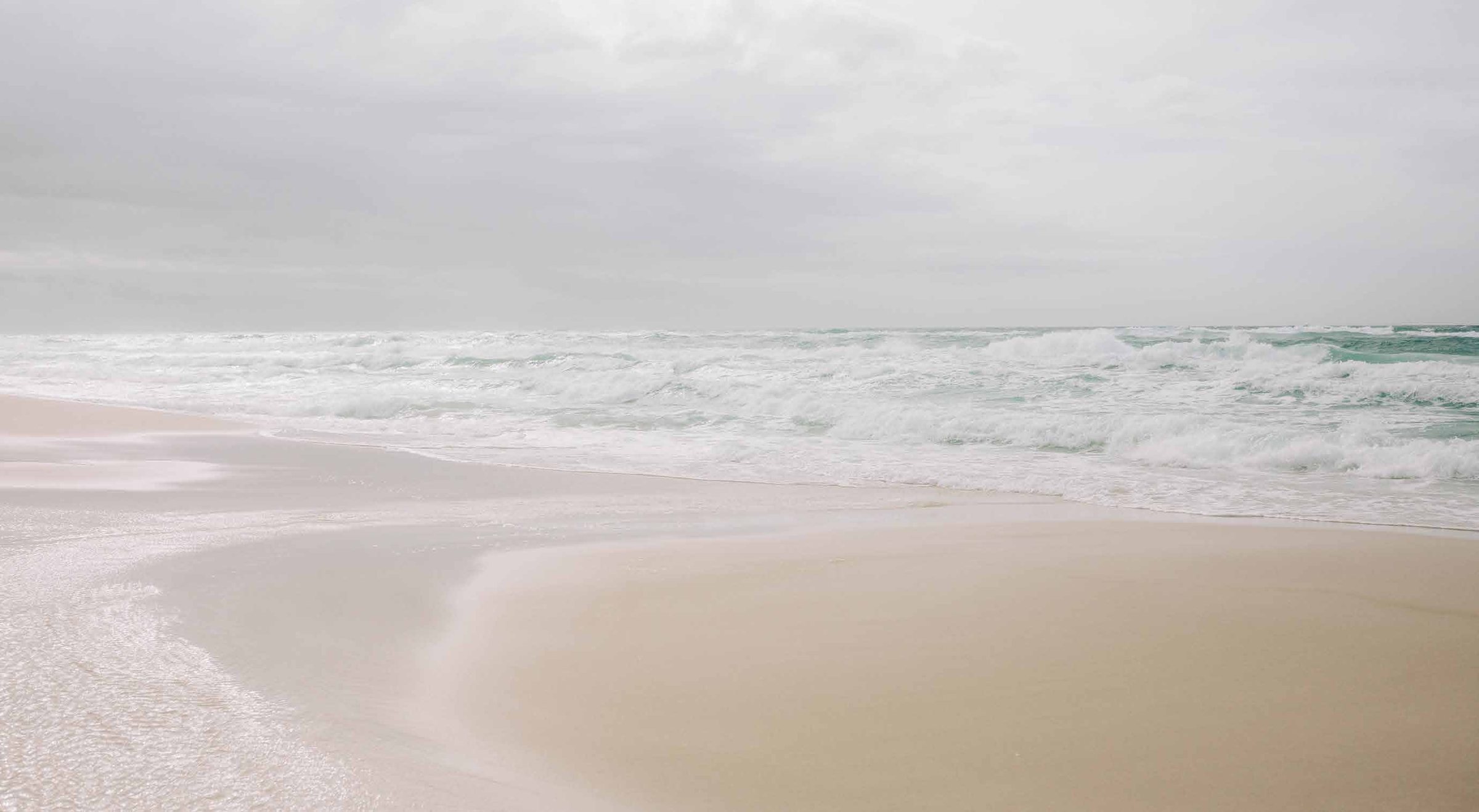Emerald Coast shoreline with white sand and turquoise water